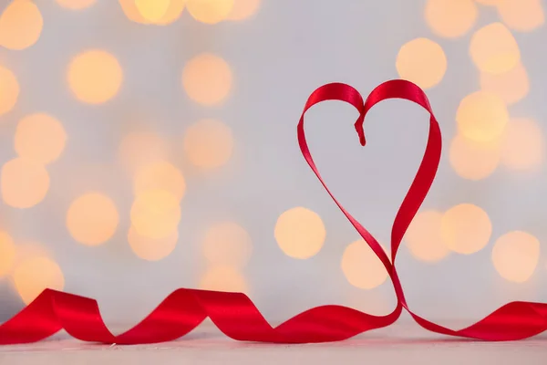 Heart Made Red Satin Ribbon Table Blurred Lights Valentine Day — стокове фото