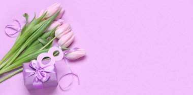 Bouquet of tulips, gift and figure 8 on lilac background with space for text. International Women's Day