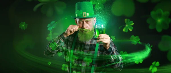 Funny mature man with glass of beer on dark green background. St. Patrick\'s Day celebration