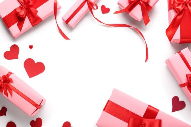 Frame made of gift boxes and paper hearts on white background, closeup. Valentine's Day celebration