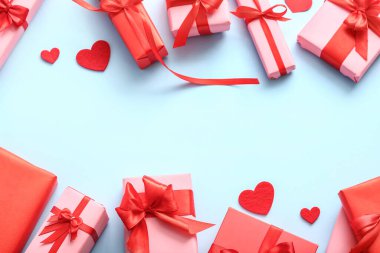 Composition with beautiful gift boxes and decor on color background. Valentine's Day celebration