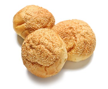 Delicious buns with sesame seeds isolated on white background