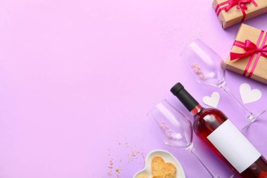 Composition with bottle of wine, glasses and gifts for Valentines Day on lilac background