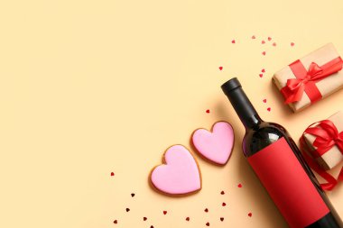 Composition with bottle of wine, cookies and gifts for Valentines Day on color background