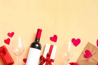 Composition with bottle of wine, glasses and gifts for Valentines Day on color background