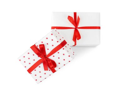 Gift boxes with red satin ribbon isolated on white background. Valentine's Day celebration