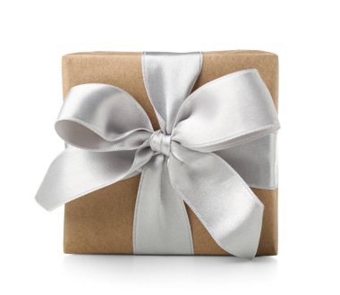 Gift box wrapped in craft paper with silk bow on white background