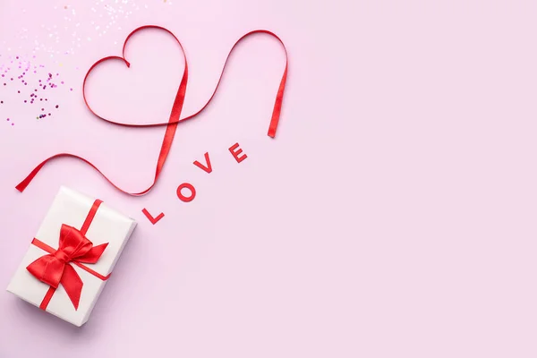 Word Love Gift Heart Made Red Satin Ribbon Pink Background — Φωτογραφία Αρχείου