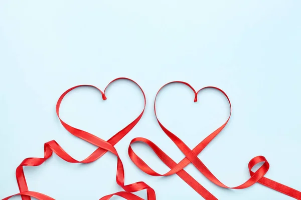 Hearts Made Red Satin Ribbon Blue Background Valentine Day Celebration — стокове фото
