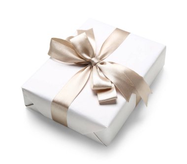 Gift box tied with shiny satin ribbon on white background
