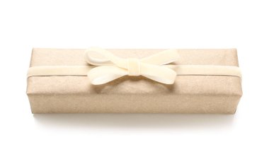 Gift box tied with velvet ribbon on white background
