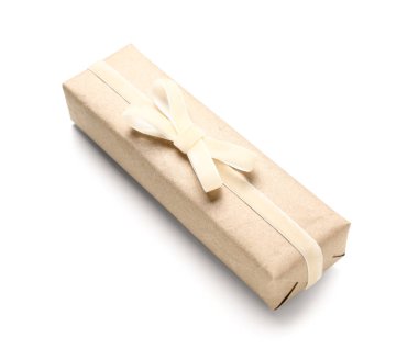 Gift box tied with velvet ribbon on white background