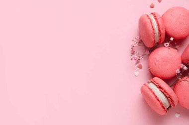Tasty macaroons on pink background. Valentine's Day celebration