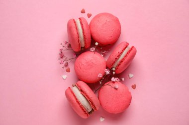 Tasty macaroons on pink background. Valentine's Day celebration