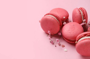 Tasty macaroons on pink background. Valentine's Day celebration