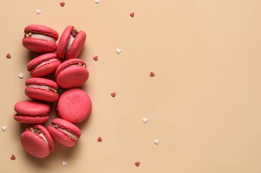 Tasty macaroons on beige background. Valentine's Day celebration