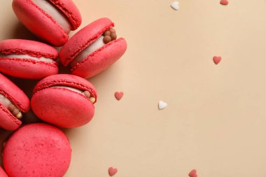 Tasty macaroons on beige background. Valentine's Day celebration