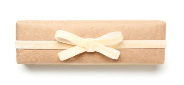 Gift box tied with velvet ribbon on white background