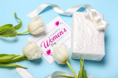 Composition with gift box, greeting card and beautiful tulip flowers for Women's Day celebration on color background, closeup