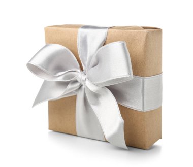 Gift box wrapped in craft paper with silk bow on white background