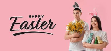 Easter banner with happy young couple in bunny ears on pink background