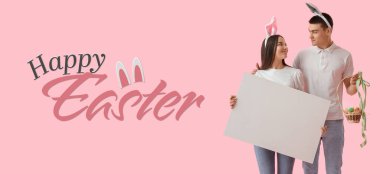 Banner with happy young couple in bunny ears, with Easter eggs in basket and blank poster on pink background