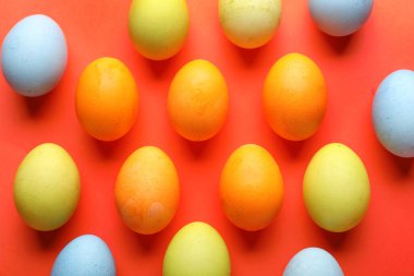 Colorful Easter eggs on color background