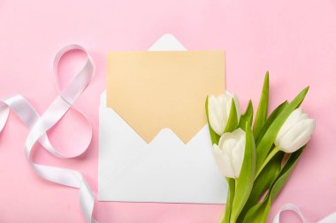 Composition with blank card, tulip flowers and ribbon in shape of figure 8 on pink background. Women's Day celebration