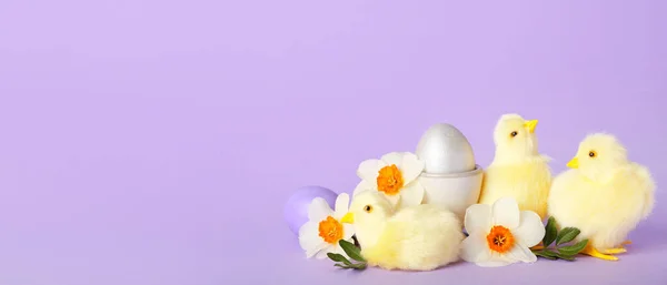 Cute chickens, flowers and Easter eggs on lilac background with space for text
