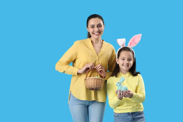 Beautiful Woman Her Little Daughter Easter Eggs Rabbit Blue Background — Stock fotografie