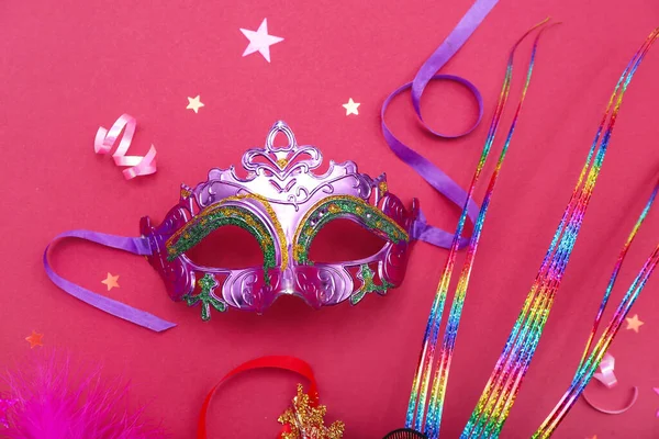 Carnival mask with stars on pink background