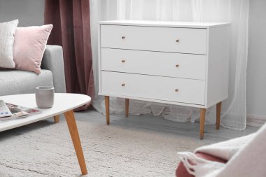 White chest of drawers in light living room