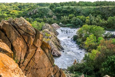 View of beautiful river with green trees and rocks
