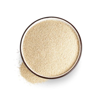Bowl of amaranth seeds on white background