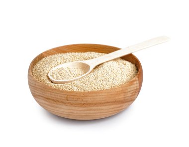 Wooden bowl of amaranth seeds on white background