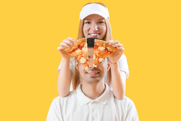 Young Couple Pieces Tasty Pizza Yellow Background — Stock Photo, Image