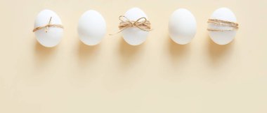 Easter eggs on beige background
