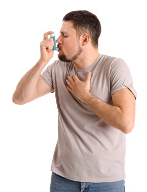 Sick man with inhaler on white background