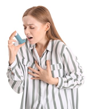 Sick young woman with inhaler on white background