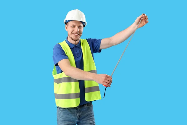 Male Worker Tape Ruler Blue Background — Photo