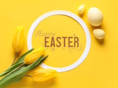 Text HAPPY EASTER, eggs and flowers on yellow background