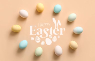 Greeting card for Easter celebration with painted eggs on beige background