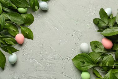 Composition with plant branches and Easter eggs on grunge background