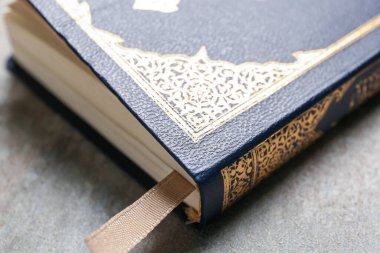 Koran for Ramadan on grunge background, closeup
