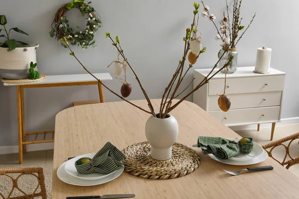 Beautiful dinnerware on wooden table served for Easter celebration