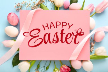 Easter greeting card, flowers and eggs on light blue background