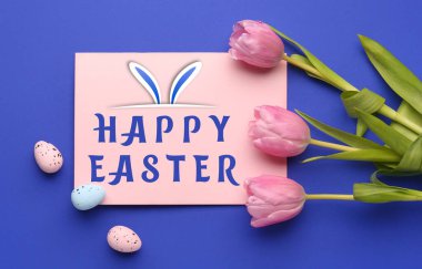 Easter greeting card, tulips and painted eggs on blue background
