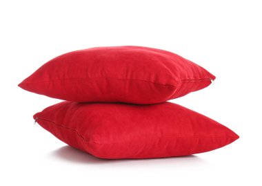 Red decorative pillows on white background