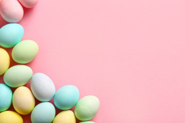 Composition with beautiful Easter eggs on pink background