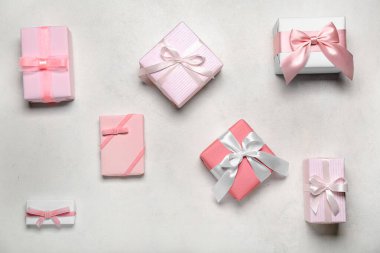 Gifts for Women's Day celebration on grey background